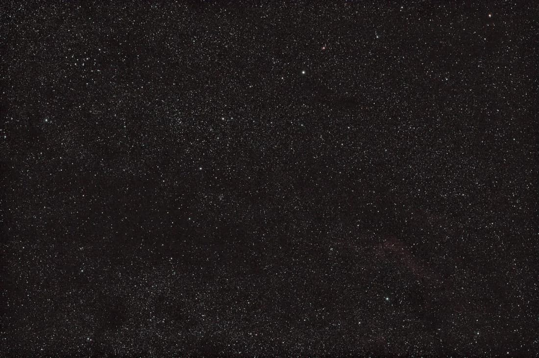 A broad Cygnus star field with the M39 star cluster in the upper left